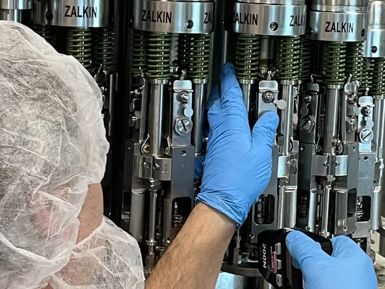 Worker Using a Beverage Filling Machine