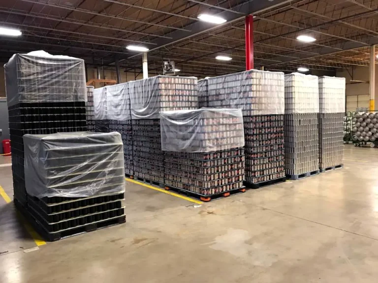 Cans stacked in warehouse